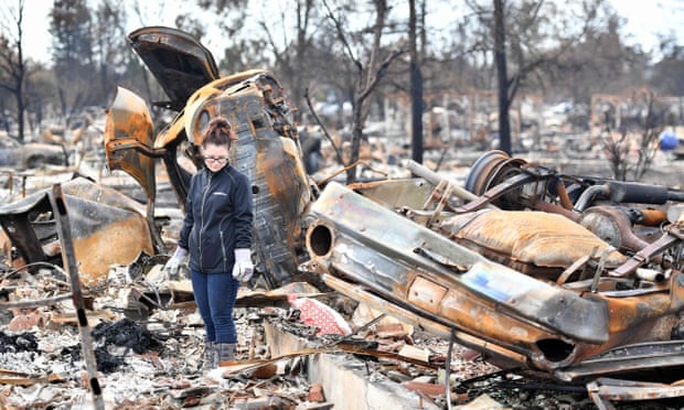 A resident walks through her burned property in Santa Rosa, California. More than 8,000 buildings were destroyed by the wildfires. 