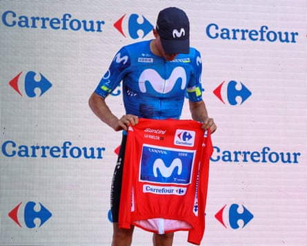 The new overall race leader, Enric Mas, holds the red jersey after Tadej Pogacar’s withdrawal.