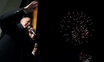 Recep Tayyip Erdoğan addresses supporters from the balcony of AK party headquarters in Ankara on Sunday.
