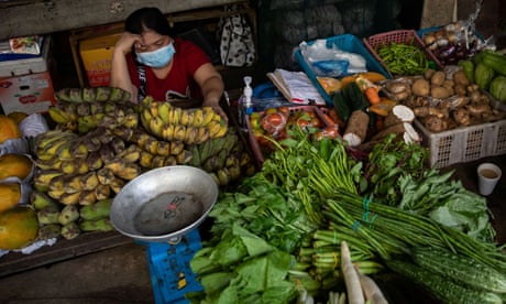 woman at market stall in the Philippines