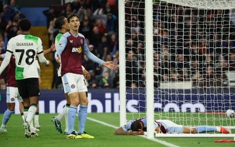 Aston Villa's Diego Carlos and Pau Torres react after Carlos put the ball wide from a couple of yards out against Liverpool.