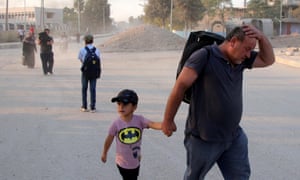 Kurdish families flee their home towns Ras al-Ein due to the Turkish offensive in northern Syria.