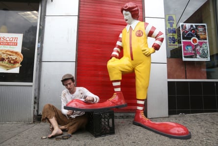 Ronald McDonald having his shoes shined.