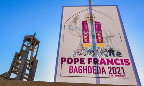 A sign welcoming Pope Francis hangs outside the Syriac Catholic church of Mar Thoma (St Thomas), in the predominantly Christian town of Qaraqosh.
