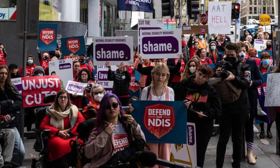 People protest against NDIS funding cuts outside the Administrative Appeals Tribunal in Melbourne
