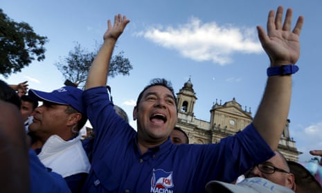Guatemalan presidential candidate Jimmy Morales appears before a political rally in downtown Guatemala City.