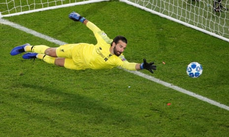Liverpool’s Alisson attempts to save a goal from Paris St Germain’s Marquinhos (not pictured), which is disallowed due to offside.