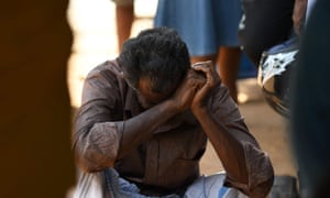 A man weeps outside a hospital in Batticaloa, eastern Sri Lanka.