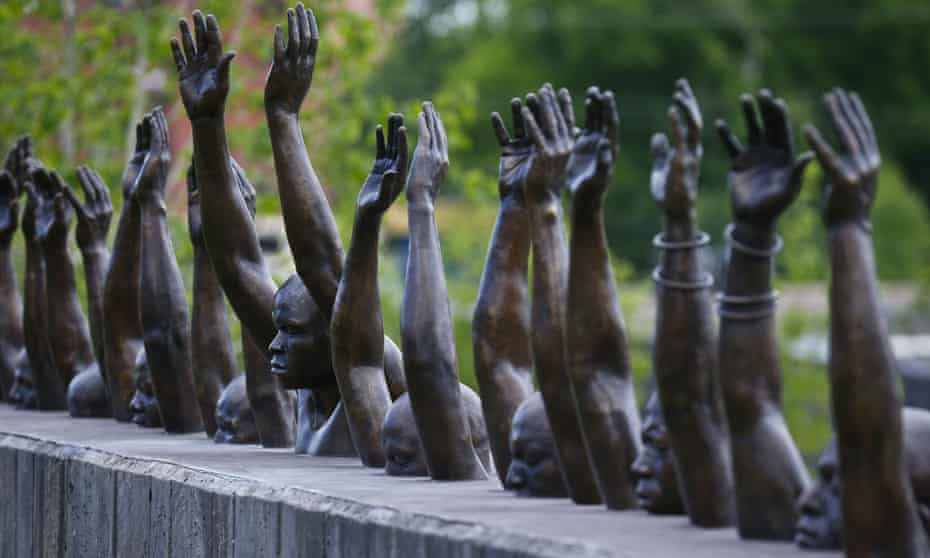 A bronze statue called ‘Raise Up’, part of the display at the National Memorial for Peace and Justice, a memorial to honor thousands of people killed in lynchings, in Montgomery, Alabama.