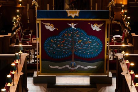 The anointing screen featuring a tree and three angels.