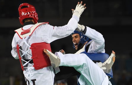 Iran’s Sajjad Mardani (left) competes against Pita Taufatofua during the men’s taekwondo qualifying bout in the +80kg category at the Rio 2016 Olympics.