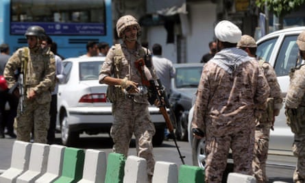 Members of the Iranian Revolutionary Guard secure the area outside the parliament building.