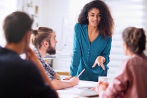 Four people in a work meeting