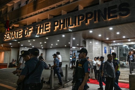 Police arrive outside the senate of the Philippines in Pasay, Manila on Wednesday.