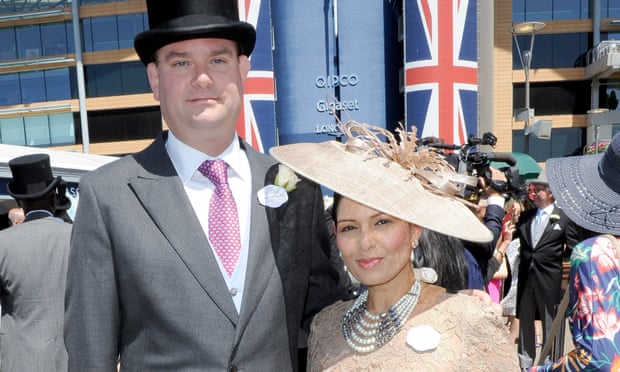 Priti Patel, the home secretary, with her husband, Alex Sawyer, at Royal Ascot. 