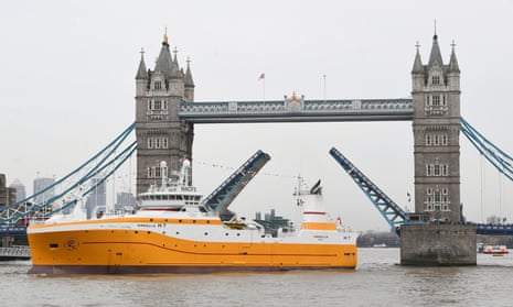The distant-water fishing trawler Kirkella passes under Tower Bridge in London.