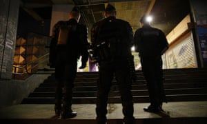 French police officers stand guard in Aulnay-sous-Bois last month after clashes between police and youths.