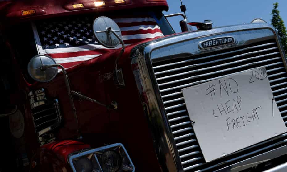 A sign is placed on a semi-trailer truck as truckers protest about low rates and lack of broker transparency during the coronavirus pandemic in Washington on Friday.
