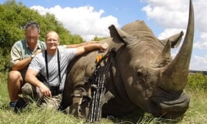 Walter Palmer, right, with one of his kills – a White Rhino. He also hunted and killed Cecil, an enormous, black-maned lion popular with tourists and a focus of research, in 2015 in Zimbabwe.