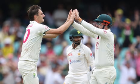 Australia’s Pat Cummins celebrates his fourth wicket on Day 1, Sajid Khan for 15.