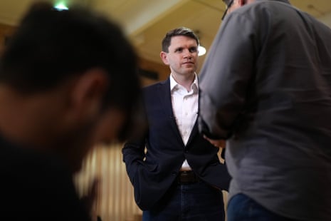 James Talarico standing with his hands in his pockets.