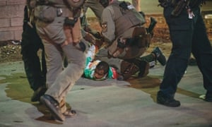 Police detain a protester last night in Louisville, Kentucky.