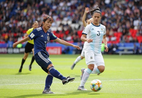 Emi Nakajima of Japan shoots under pressure from Eliana Stabile of Argentina.