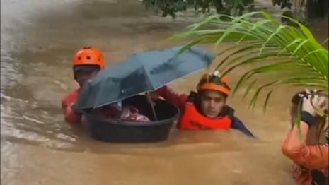 One-month old baby rescued after Typhoon Rai hits Philippines – video