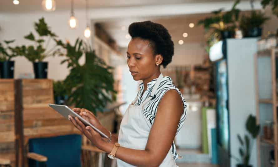 Shot of a young woman using a digital tablet while working in a waste free store