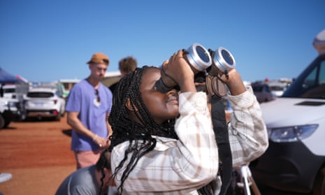 People preparing and watching the total solar eclipse at a viewing site 35km from Exmouth, Western Australia, Thursday, April 20, 2023.