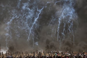 Israeli troops fire teargas at Palestinian protesters during clashes after protests near the border with Israel in the northern part of the Gaza Strip