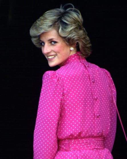 Diana’s hair is perfectly feathered and bouffant, offsetting her pearl earrings and puff-sleeve dress