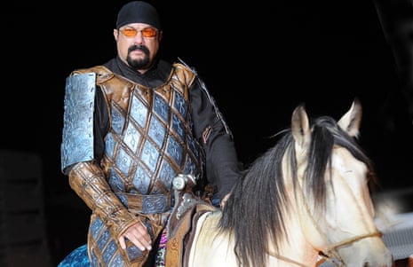 Steven Seagal rides a horse at the opening of the World Nomad Games.