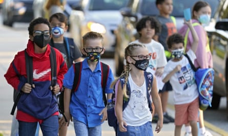 children walk to school with masks on