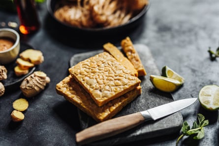 Blocks of tempeh on a chopping board