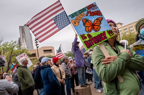 People rally at the Dallas City Hall Plaza in protest against the Trump administration during a “No Kings” demonstration on March 28, 2026 in Dallas, Texas.