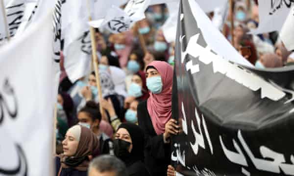 Palestinians protest against Emmanuel Macron in the West Bank city of Hebron on Saturday.