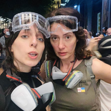 mother and daughter with goggles and masks