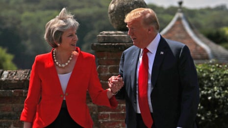 May and Trump hold hands as they arrive at press conference – video
