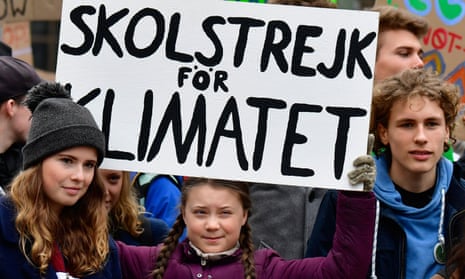 German climate activist Luisa Marie Neubauer (left) and Swedish climate activist Greta Thunberg (centre) demonstrating in Berlin on 29 March