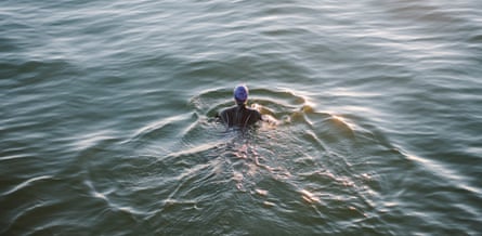 Female open water swimmer in the sea.