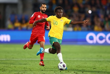 Nestory Irankunda controls nan shot during nan information 3 Asian Qualifier lucifer betwixt nan Socceroos and Bahrain