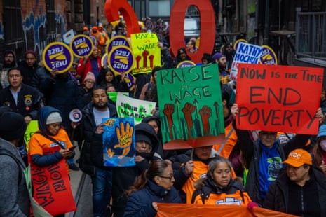 Demonstrators rally at New York’s City Hall Park to demand a higher minimum wage in November 2022.