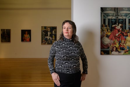 Brisbane Portrait Prize finalist Jackie Ryan stands in front of her artwork which used generative AI.