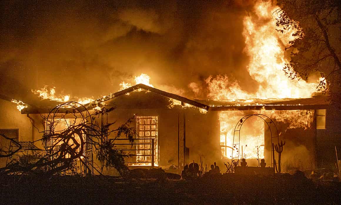 A house burns on Platina Road as a wildfire sweeps California