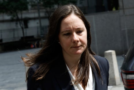 Maurene Comey, prosecutor in the Epstein case, looks down while walking outside court