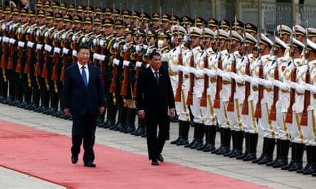 Rodrigo Duterte and Xi Jinping review the honour guard during the welcome ceremony at the Great Hall of the People in Beijing, China.