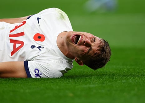 Tottenham Hotspur's Micky van de Ven reacts after sustaining a hamstring injury.