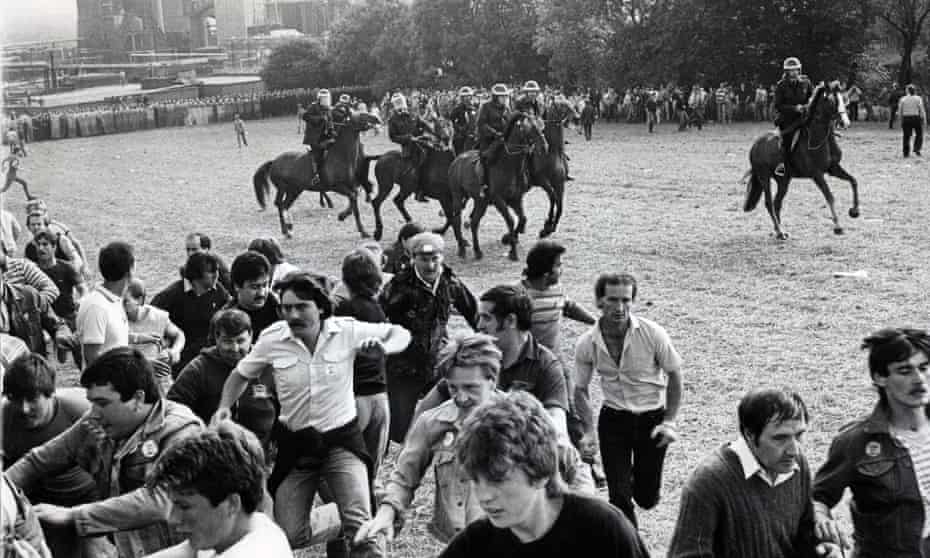 Striking miners flee a charge by mounted police at Orgreave coking works in south Yorkshire in 1984.
