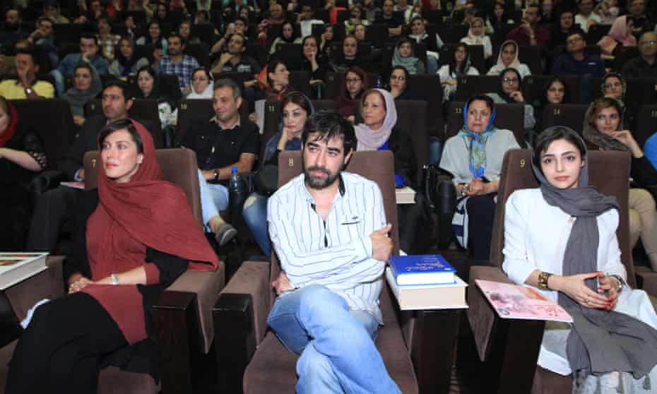Mahtab Keramati, left, and Shahab Hosseini, centre, at a campaign event in Tehran.